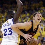 
              Cleveland Cavaliers center Timofey Mozgov, right, shoots against Golden State Warriors forward Draymond Green (23) during the first half of Game 2 of basketball's NBA Finals in Oakland, Calif., Sunday, June 7, 2015. (AP Photo/Ben Margot)
            