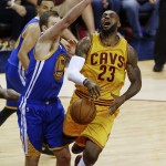 
              Cleveland Cavaliers forward LeBron James (23) reacts as he looses the ball as he's hit by Golden State Warriors forward David Lee (10) during the second half of Game 4 of basketball's NBA Finals in Cleveland, Thursday, June 11, 2015. (AP Photo/Paul Sancya)
            