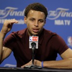 
              Golden State Warriors guard Stephen Curry (30) answers a question during a press conference following Game 4 of basketball's NBA Finals in Cleveland, early Friday, June 12, 2015. The Warriors defeated the Cleveland Cavaliers 103-82 to tie the best-of-seven game series at 2-2. (AP Photo/Tony Dejak)
            