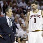 
              FILE - In this April 19, 2015, file photo, Cleveland Cavaliers head coach David Blatt, left, talks with Kevin Love (0) during an NBA playoff basketball game in Cleveland. A person familiar with the decision says Love has opted out of the final year of his contract and will be a free agent on July 1.  Love can test the market, where he will likely draw major interest, or stay in Cleveland and chase an NBA title with superstar LeBron James. (AP Photo/Mark Duncan, File)
            