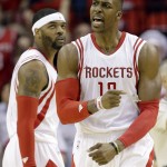 
              Houston Rockets center Dwight Howard (12) reacts as forward Josh Smith, left, looks on during the second half in Game 3 of the NBA basketball Western Conference finals against the Golden State Warriors, Saturday, May 23, 2015, in Houston. (AP Photo/David J. Phillip)
            