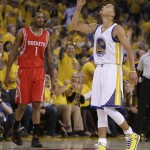 
              Golden State Warriors' Stephen Curry, right, celebrates near Houston Rockets' Trevor Ariza after a score during the first quarter of Game 1 of the NBA basketball Western Conference finals Tuesday, May 19, 2015, in Oakland, Calif. (AP Photo/Ben Margot)
            