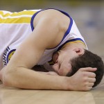 
              In this photo taken May 27, 2015, Golden State Warriors guard Klay Thompson reacts after taking a knee to his head from Houston Rockets forward Trevor Ariza during the second half of Game 5 of the NBA basketball Western Conference finals. The Warriors hope to get healthy and stay in tune over the next week before facing the Cleveland Cavaliers in the NBA Finals. Thompson needs to pass through the league's concussion protocol and Stepehen Curry is trying to get his aching body back at full strength.   (AP Photo/Ben Margot)
            
