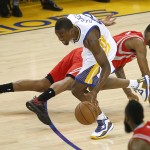 
              Golden State Warriors forward Harrison Barnes, left, dribbles past Houston Rockets forward Trevor Ariza during the first half of Game 1 of the NBA basketball Western Conference finals in Oakland, Calif., Tuesday, May 19, 2015. (AP Photo/Tony Avelar)
            