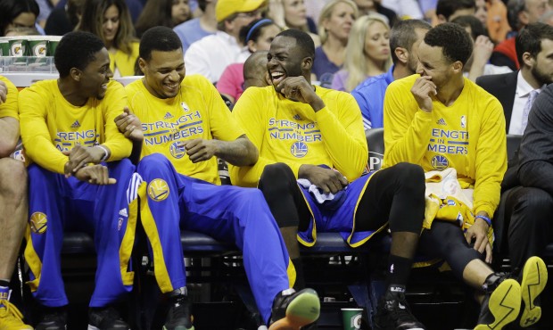 Golden State Warriors players laugh on the bench in the second half of Game 6 of a second-round NBA...