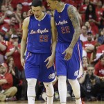 
              Los Angeles Clippers' Austin Rivers (25) and Matt Barnes (22) walk off the court following Game 2 in a second-round NBA basketball playoff series against the Houston Rockets, Wednesday, May 6, 2015, in Houston. Houston won 115-109. (AP Photo/David J. Phillip)
            