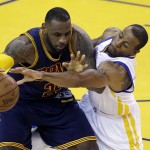 
              Cleveland Cavaliers forward LeBron James, left, is guarded by Golden State Warriors forward Andre Iguodala during the second half of Game 2 of basketball's NBA Finals in Oakland, Calif., Sunday, June 7, 2015. (AP Photo/Eric Risberg)
            