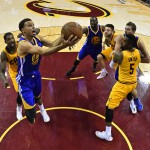 
              In this image made with a fisheye lens, Golden State Warriors guard Stephen Curry (30) shoots in front of Cleveland Cavaliers center Tristan Thompson (13) during the second half of Game 3 of basketball's NBA Finals in Cleveland, Tuesday, June 9, 2015. The Cavaliers defeated the Warriors 96-91. (Larry W. Smith/Pool Photo via AP)
            