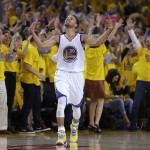 
              Fans cheer as Golden State Warriors guard Stephen Curry (30) reacts after scoring during the first half of Game 5 in a second-round NBA playoff basketball series against the Memphis Grizzlies in Oakland, Calif., Wednesday, May 13, 2015. (AP Photo/Ben Margot)
            