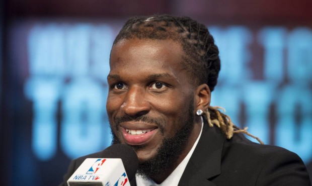 Toronto Raptors’ DeMarre Carroll smiles after being introduced at a press conference in Toron...