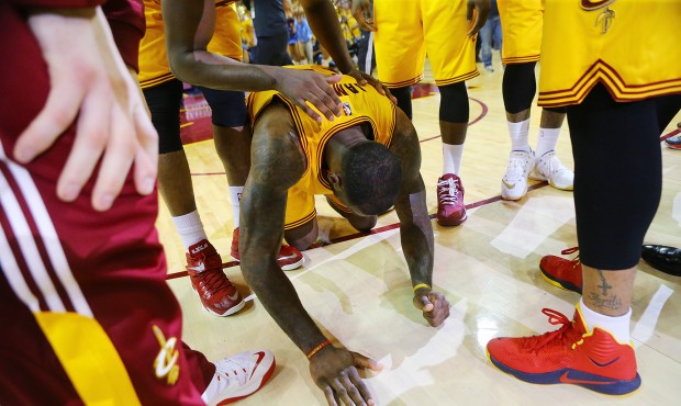 Cleveland Cavaliers’ LeBron James falls to the floor as time expires in their game against th...