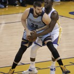 
              Memphis Grizzlies center Marc Gasol (33) is guarded by Golden State Warriors forward Draymond Green during the first half of Game 5 in a second-round NBA playoff basketball series in Oakland, Calif., Wednesday, May 13, 2015. (AP Photo/Jeff Chiu)
            