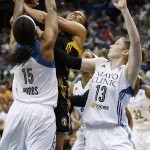 
              Tulsa Shock's forward Plenette Pierson, center, tries to shoot against the defense of Minnesota Lynx forward Asjha Jones (15) and guard Lindsey Whalen (13) during the first half of a WNBA basketball game, Sunday, June 21, 2015, in Minneapolis. (AP Photo/Stacy Bengs)
            