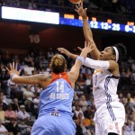 
              Connecticut Sun's Kelsey Bone (3) shoots over Atlanta Dream's Erika de Souza (14) during the first half of a WNBA basketball game in Uncasville, Conn., on Sunday, June 14, 2015. (AP Photo/Fred Beckham)
            