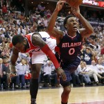 
              Atlanta Hawks guard Jeff Teague (0) reacts after he was fouled by Washington Wizards guard Will Bynum in the second half of Game 4 of the second round of the NBA basketball playoffs Monday, May 11, 2015, in Washington. The Hawks won 106-101. (AP Photo/Alex Brandon)
            