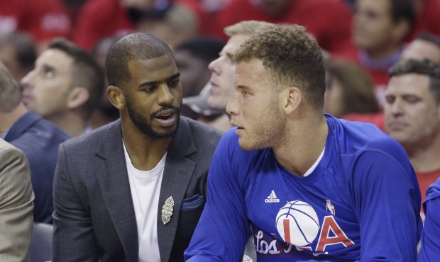 Los Angeles Clippers’ Chris Paul, left, and Blake Griffin sit on the bench during the first h...