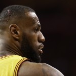 
              Blood shows on the head Cleveland Cavaliers forward LeBron James (23) during the second half of Game 4 of basketball's NBA Finals against the Golden State Warriors in Cleveland, Thursday, June 11, 2015. (AP Photo/Tony Dejak)
            