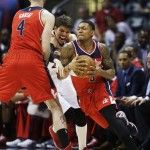 
              Atlanta Hawks' Kyle Korver, center, runs into a pick set by Washington Wizards' Marcin Gortat, left, of Poland as teammate Bradley Beal dribbles by in the second quarter of Game 5 of the second round of the NBA basketball playoffs Wednesday, May 13, 2015, in Atlanta. (AP Photo/John Bazemore)
            