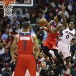 
              Washington Wizards' Bradley Beal, left, puts up a shot against Atlanta Hawks' Jeff Teague, right, in the first quarter of Game 5 of the second round of the NBA basketball playoffs Wednesday, May 13, 2015, in Atlanta. (AP Photo/John Bazemore)
            