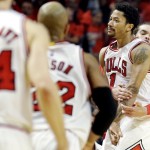 
              Chicago Bulls guard Derrick Rose (1) celebrates with Joakim Noah, right, and Taj Gibson after scoring the game-winning 3-point basket during the second half of Game 3 in a second-round NBA basketball playoff series against the Cleveland Cavaliers in Chicago, Friday, May 8, 2015. The Bulls won 99-96. (AP Photo/Nam Y. Huh)
            