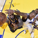 
              Cleveland Cavaliers forward LeBron James, left, shoots against Golden State Warriors forward Marreese Speights during the first half of Game 2 of basketball's NBA Finals in Oakland, Calif., Sunday, June 7, 2015. (Kyle Terada/USA TODAY Sports Pool via AP)
            