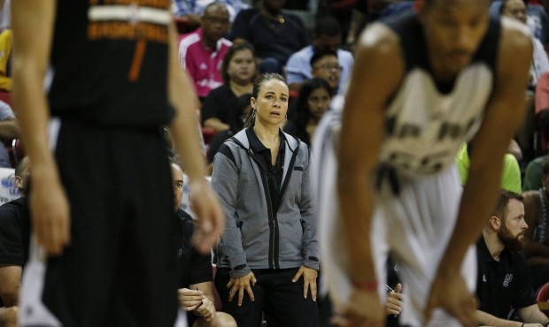 Becky Hammon coaches the San Antonio Spurs against the Phoenix Suns during the first half of an NBA...