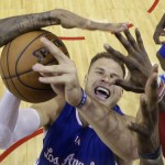 
              Los Angeles Clippers' Blake Griffin is blocked by Houston Rockets defenders as he tries to score during the second half of Game 2 in a second-round NBA basketball playoff series, Wednesday, May 6, 2015, in Houston. (AP Photo/David J. Phillip)
            