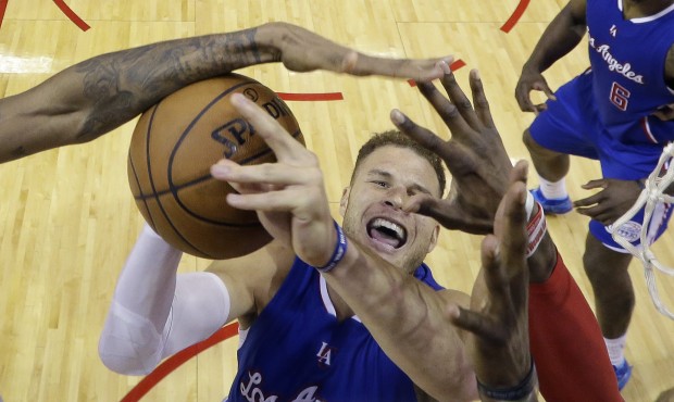 Los Angeles Clippers’ Blake Griffin is blocked by Houston Rockets defenders as he tries to sc...