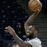 
              Cleveland Cavaliers' LeBron James shoots during NBA basketball practice, Wednesday, June 3, 2015, in Oakland, Calif. The Golden State Warriors host the Cavaliers in Game 1 of the NBA Finals on Thursday. (AP Photo/Ben Margot)
            