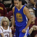 
              Golden State Warriors guard Stephen Curry (30) reacts during the second half of Game 4 of basketball's NBA Finals against the Cleveland Cavaliers, in Cleveland, Thursday, June 11, 2015. (AP Photo/Paul Sancya)
            