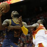 
              Cleveland Cavaliers forward LeBron James (23) shoots as Atlanta Hawks forward DeMarre Carroll (5) defends during the second half in Game 2 of the Eastern Conference finals of the NBA basketball playoffs, Friday, May 22, 2015, in Atlanta. (AP Photo/David Goldman)
            