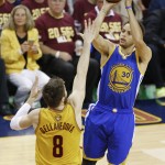 
              Golden State Warriors guard Stephen Curry (30) shoots over Cleveland Cavaliers guard Matthew Dellavedova (8) during the first half of Game 4 of basketball's NBA Finals in Cleveland, Thursday, June 11, 2015. (AP Photo/Paul Sancya)
            