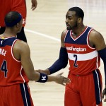 
              Washington Wizards' John Wall, right, congratulates teammate Paul Pierce in the first quarter of Game 5 of the second round of the NBA basketball playoffs against the Atlanta Hawks Wednesday, May 13, 2015, in Atlanta. (AP Photo/David Goldman)
            