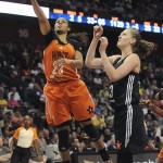 
              West’s Maya Moore, left, of the Minnesota Lynx, shoots as East’s Emma Meesseman, of the Washington Mystics, defends during the second half of the WNBA All-Star basketball game, Saturday, July 25, 2015, in Uncasville, Conn. West won 117-112. Moore was MVP with 30 points. (AP Photo/Jessica Hill)
            