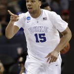 
              FILE - In this March 22, 2015, file photo, Duke's Jahlil Okafor (15) points to a teammate after a basket against San Diego State during the second half of an NCAA tournament college basketball game in the Round of 32 in Charlotte, N.C. Okafor is a top prospect in the NBA draft on Thursday, June 25, 2015. (AP Photo/Gerald Herbert, File)
            