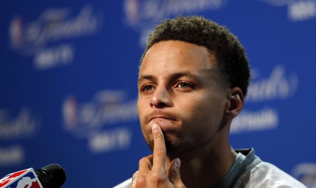 Golden State Warriors guard Stephen Curry answers a question during press conference for basketball...