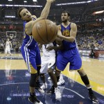 
              Golden State Warriors guard Stephen Curry, left, loses the ball out of bounds against the Memphis Grizzlies in the first half of Game 3 of a second-round NBA basketball Western Conference playoff series Saturday, May 9, 2015, in Memphis, Tenn. At right is Warriors center Andrew Bogut (12), of Australia. (AP Photo/Mark Humphrey)
            