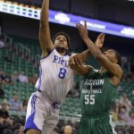 
              Philadelphia 76ers' Jahlil Okafor (8) goes to the basket as Boston Celtics' Jordan Mickey (55) defends during the first half of an NBA summer league basketball game Tuesday, July 7, 2015, in Salt Lake City. (AP Photo/Rick Bowmer)
            