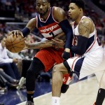 
              Washington Wizards' John Wall, left, dribbles against Atlanta Hawks' Kent Bazemore in the third quarter of Game 5 of the second round of the NBA basketball playoffs Wednesday, May 13, 2015, in Atlanta. (AP Photo/John Bazemore)
            