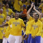 
              Golden State Warriors players react during the second half of Game 5 of the NBA basketball Western Conference finals against the Houston Rockets in Oakland, Calif., Wednesday, May 27, 2015. (AP Photo/Ben Margot)
            