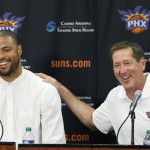               Phoenix Suns' Tyson Chandler, left, the newly signed free agent, laughs along with head coach Jeff Hornacek, right, as Chandler is introduced to the media during a news conference Thursday, July 9, 2015, in Phoenix. (AP Photo/Ross D. Franklin)
            