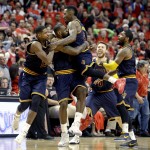 
              FILE - In this May 10, 2015, file photo, Cleveland Cavaliers' LeBron James, second from left, hugs teammate J.R. Smith, as they celebrate beating the Chicago Bulls in Game 4 of the conference semifinals in the NBA playoffs in Chicago. From left are Tristan Thompson, James, Smith, Matthew Dellavedova, and Kyrie Irving, right.  J.R. Smith, the enigmatic shooting guard, who came to the Cavaliers with the reputation of being diffcult, has found a new home in Cleveland and he's relishing the chance to be part of a team moving toward an NBA title. (AP Photo/Nam Y. Huh, File)
            