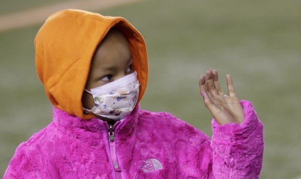 FILE – In this Nov. 6, 2014 file photo, Leah Still waves during a ceremony in the first half ...