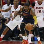 
              Cleveland Cavaliers guard Kyrie Irving (2) moves the ball as Atlanta Hawks guard Jeff Teague (0) looks on during the first half in Game 1 of the Eastern Conference finals of the NBA basketball playoffs, Wednesday, May 20, 2015, in Atlanta. (AP Photo/John Bazemore)
            