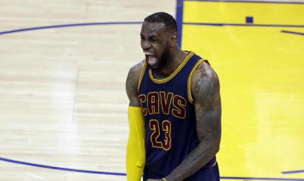 Cleveland Cavaliers forward LeBron James (23) celebrates after end of the overtime period of Game 2...