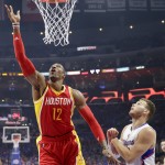 
              Houston Rockets center Dwight Howard, left, shoots as Los Angeles Clippers forward Blake Griffin looks on during the first half of Game 3 in a second-round NBA basketball playoff series Friday, May 8, 2015, in Los Angeles. (AP Photo/Jae C. Hong)
            