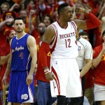 
              Houston Rockets center Dwight Howard (12) reacts to a play as Los Angeles Clippers guard J.J. Redick (4) looks on during the fourth quarter of Game 7 of the NBA Western Conference semifinals at the Toyota Center Sunday, May 17, 2015, in Houston.  ( James Nielsen / Houston Chronicle via AP )MANDATORY CREDIT
            