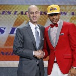 
              D’Angelo Russell, right, poses for a photo with NBA Commissioner Adam Silver after the Los Angeles Lakers selected Russell with the second pick during the NBA basketball draft, Thursday, June 25, 2015, in New York. (AP Photo/Kathy Willens)
            