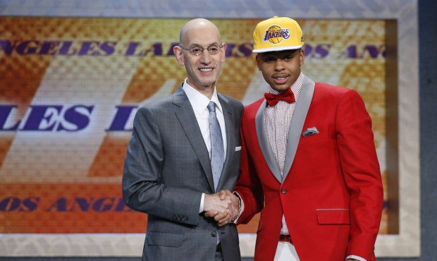 D’Angelo Russell, right, poses for a photo with NBA Commissioner Adam Silver after the Los An...