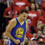 
              Golden State Warriors guard Stephen Curry (30) reacts after making a 3-point basket against the Houston Rockets during the second half in Game 3 of the NBA basketball Western Conference finals Saturday, May 23, 2015, in Houston. (AP Photo/David J. Phillip)
            
